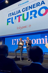 Speakers on stage at Italia Genera Futuro event