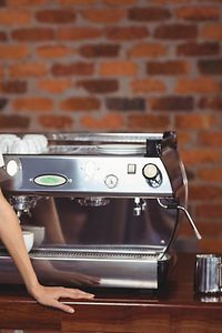 Woman at Coffee Machine