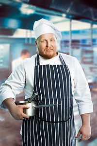 Chef with Pans in Kitchen