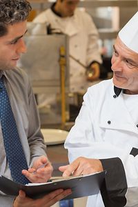 Picture of Chef and a Chef Corp. Service Manager discussing a new kitchen design